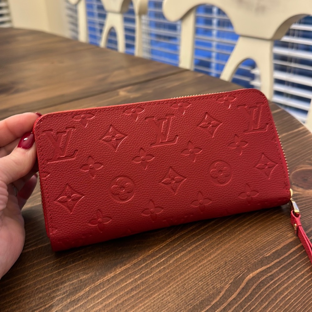 Louis Vuitton zip wallet with gold hardware. Never used